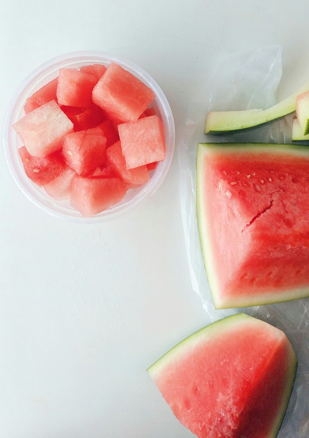 sliced watermelon on white plastic container