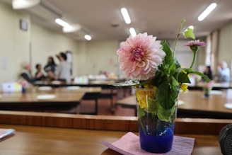 A close-up of floral centerpieces on event tables.