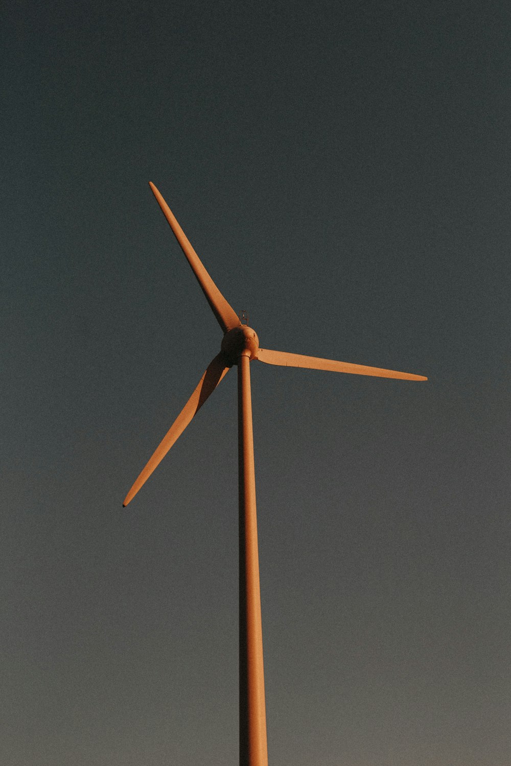 brown and white wind mill under blue sky