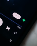 black remote control on white textile