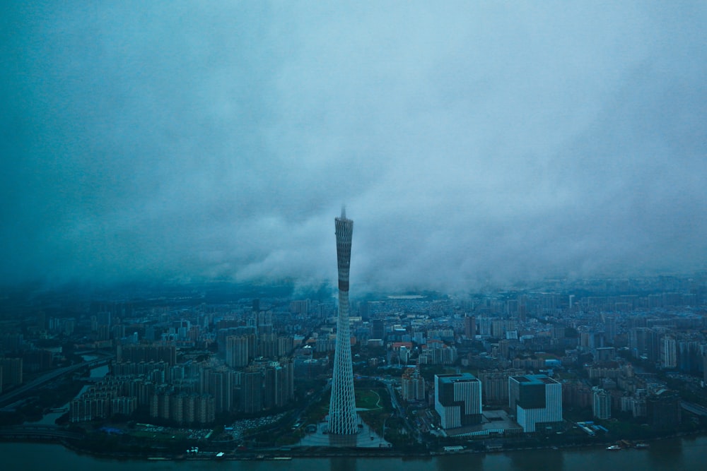 aerial view of city buildings under cloudy sky during daytime