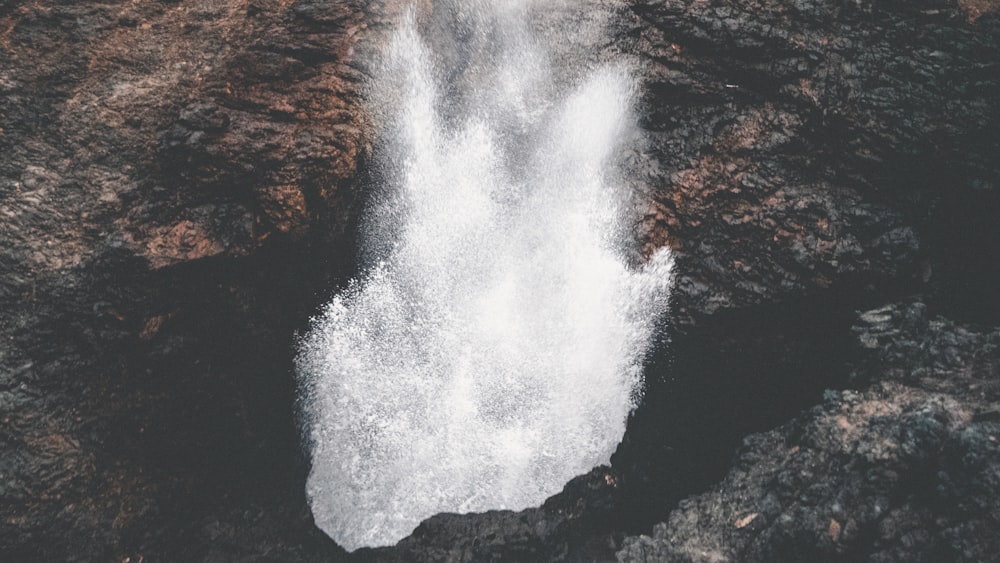 water waves on black rock