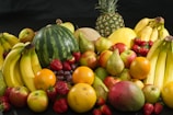 red apples and yellow round fruits