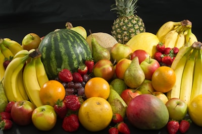 red apples and yellow round fruits