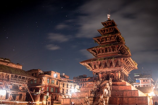 brown concrete building during night time in Nyatapola Temple Nepal