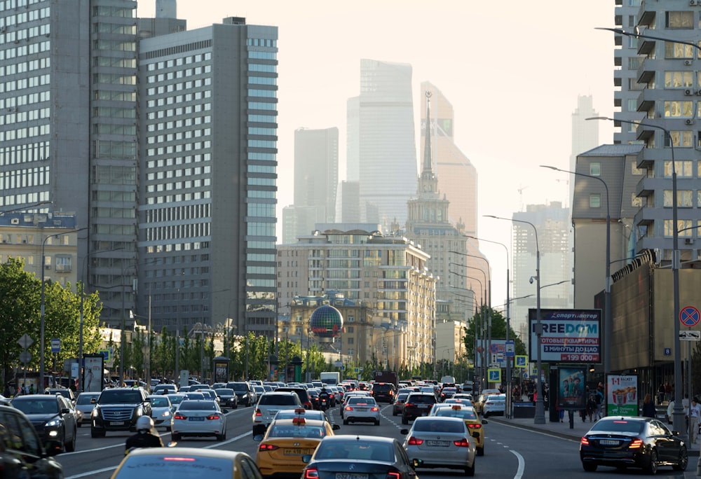 cars on road near buildings during daytime