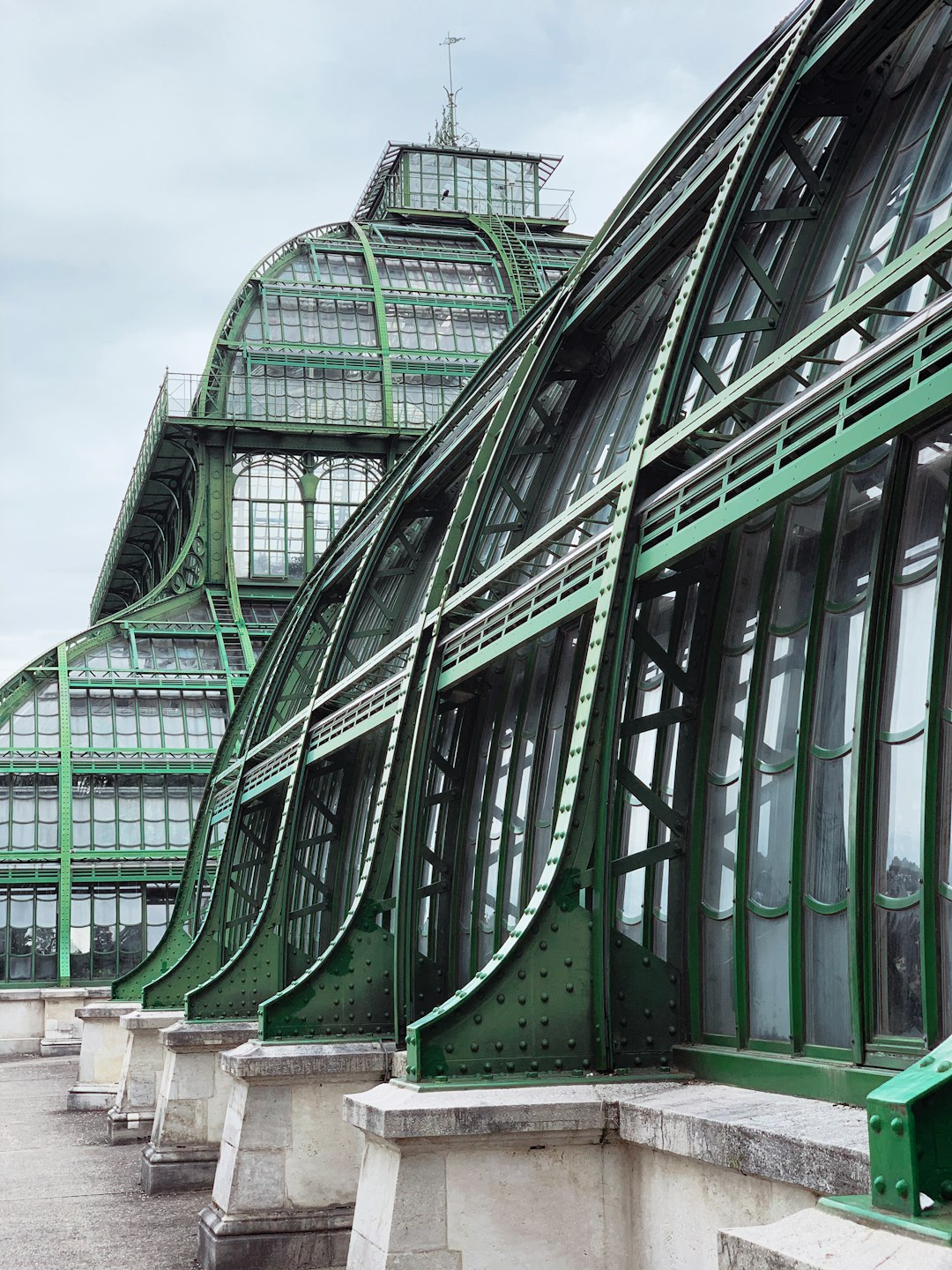 green glass walled building under blue sky during daytime