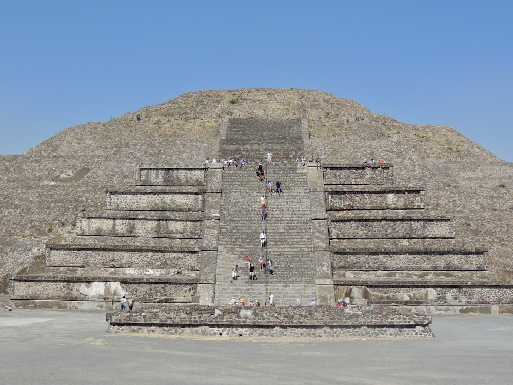 gray concrete stairs near mountain during daytime