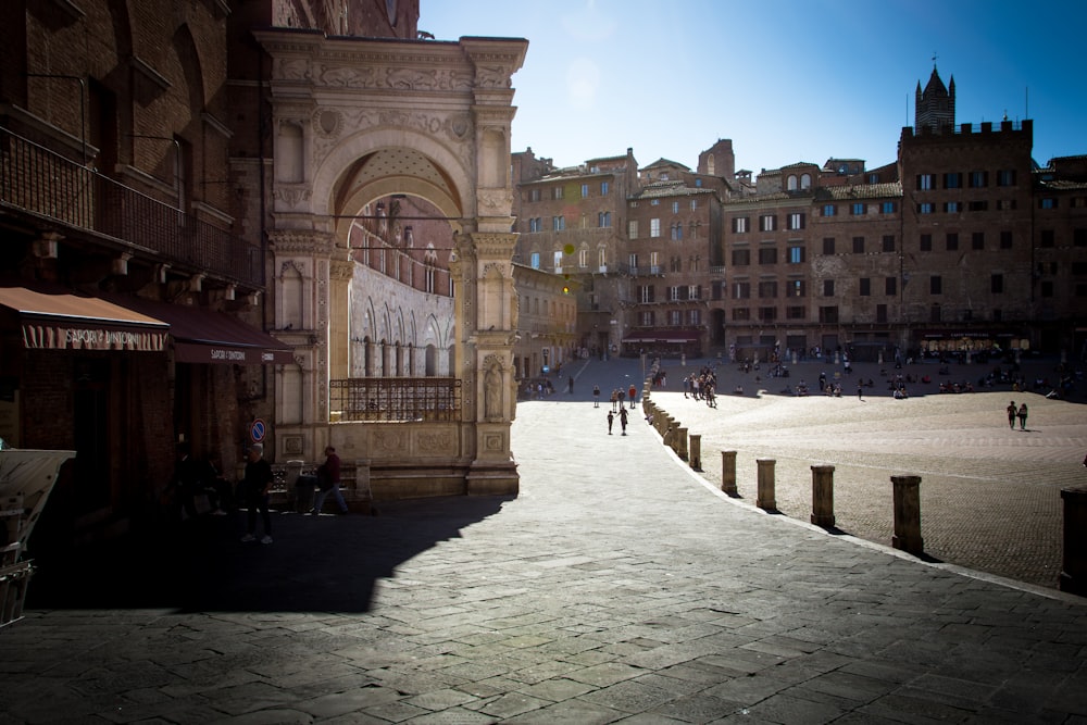 people walking on street near brown concrete building during daytime