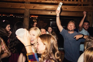 A vibrant university party with people enjoying music and socializing.