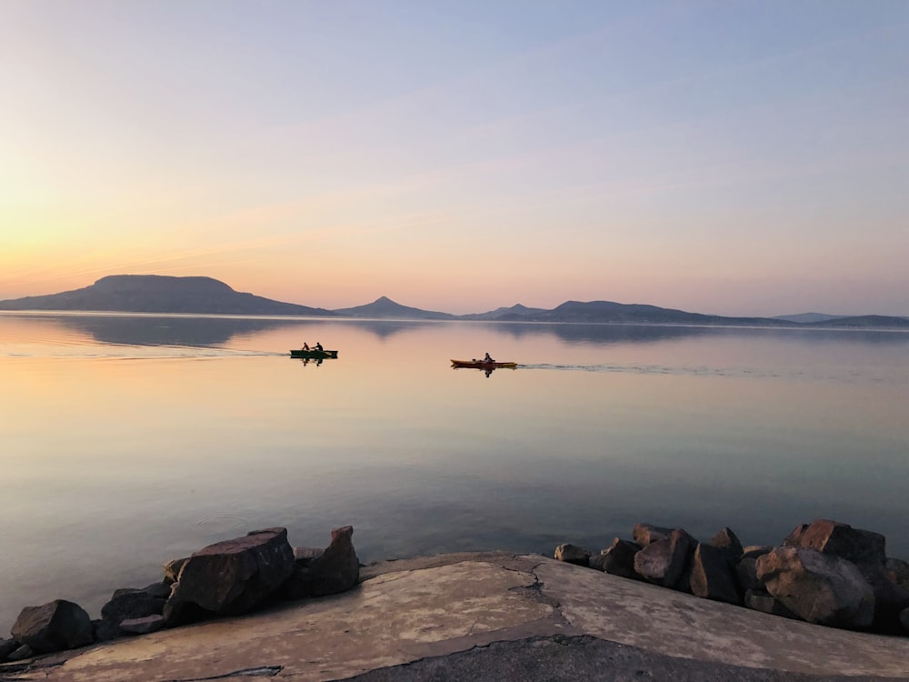 person in boat on sea during daytime