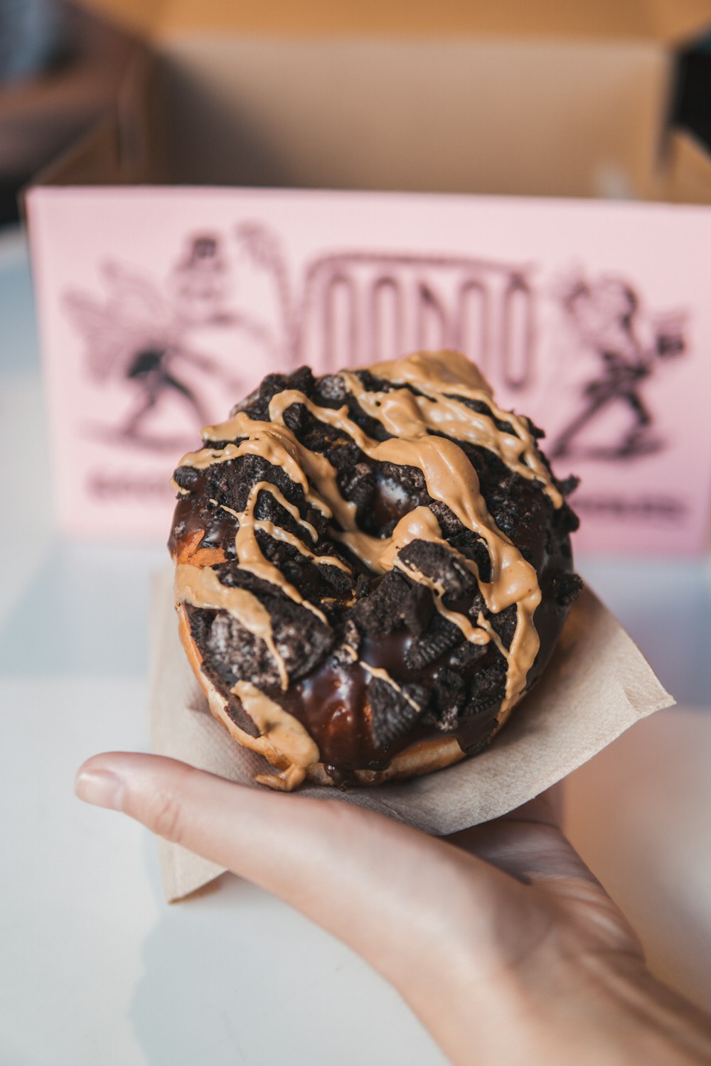 person holding chocolate ice cream