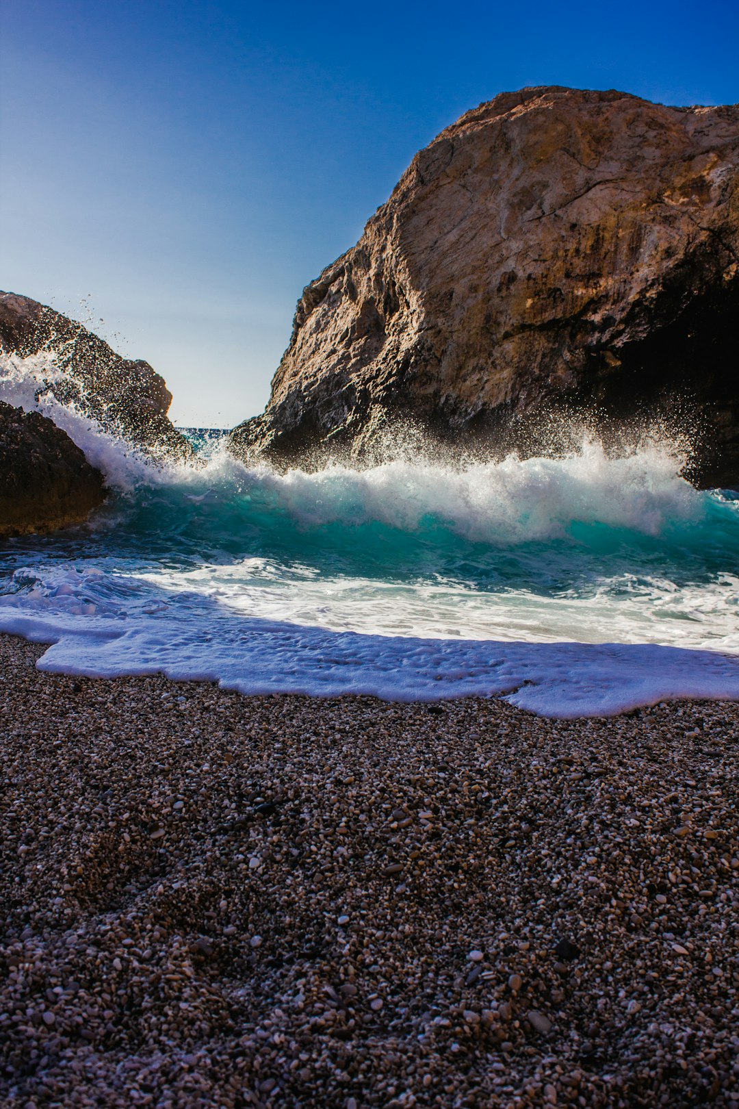 ocean waves crashing on shore during daytime