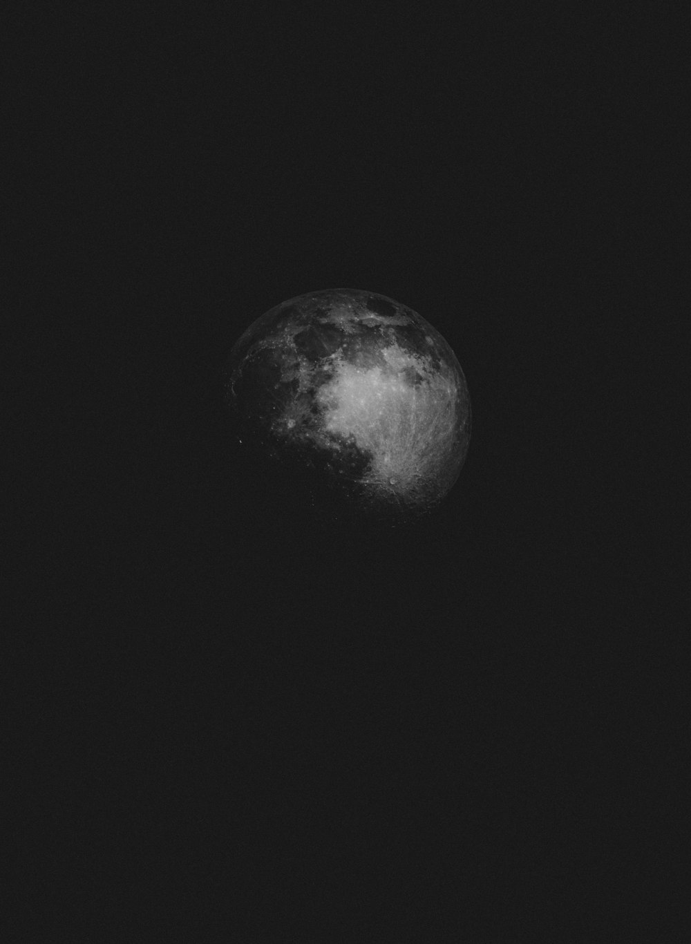 grayscale photo of moon in dark night sky
