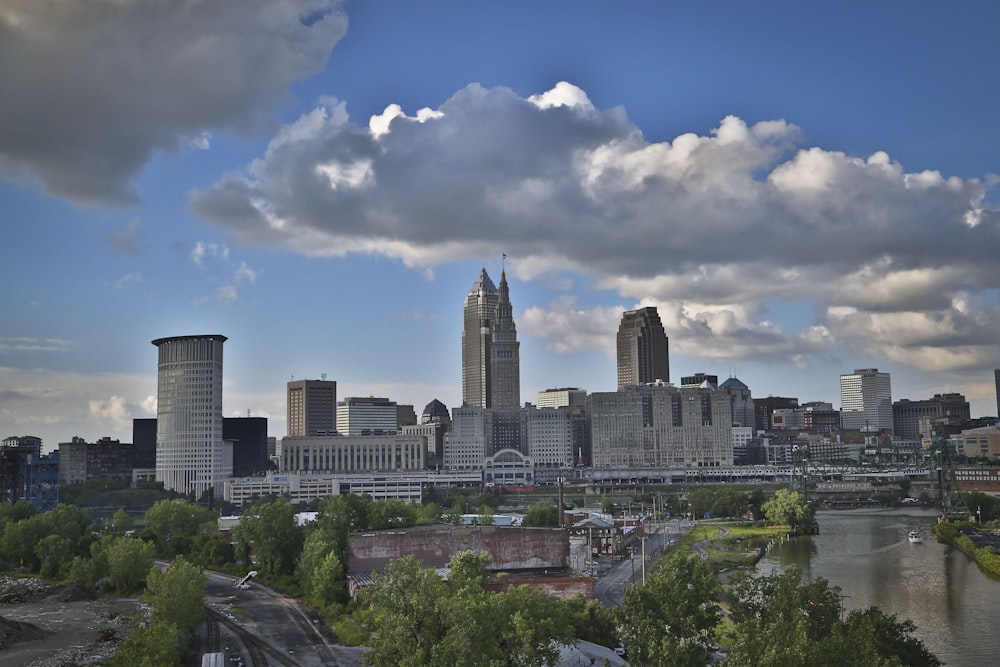 city skyline under blue and white sunny cloudy sky during daytime