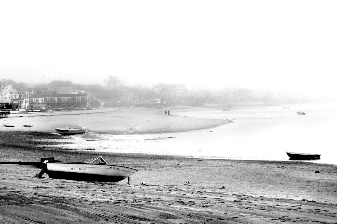 grayscale photo of boat on sea