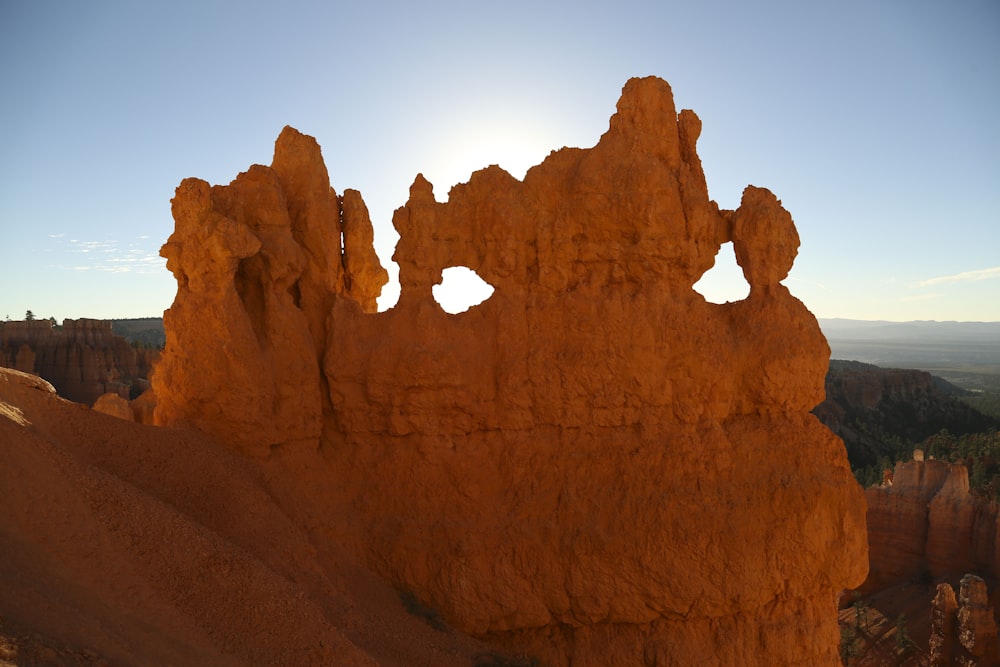 brown rock formation under blue sky during daytime