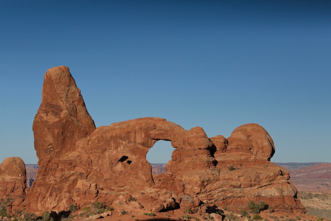 brown rock formation under blue sky during daytime