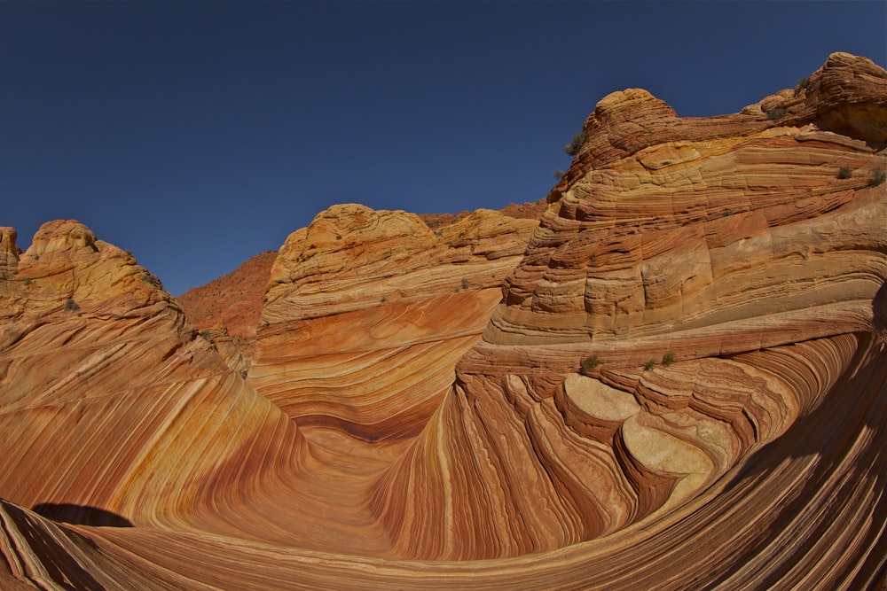 brown rock formation under blue sky during daytime