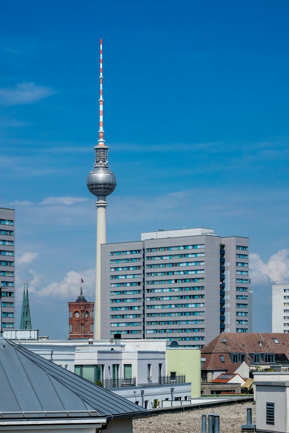 white and red tower under blue sky during daytime