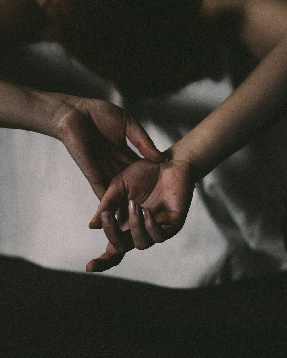 person holding babys hand