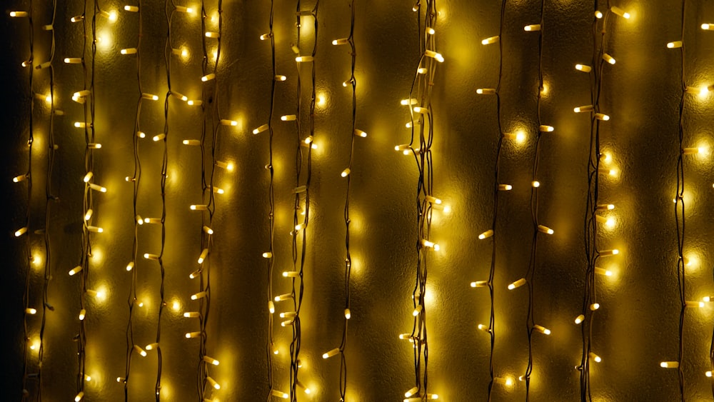 yellow string lights on brown wall