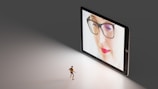 black framed eyeglasses on white table