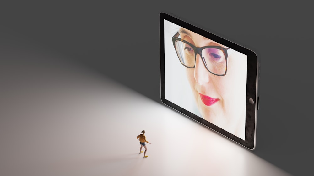 black framed eyeglasses on white table