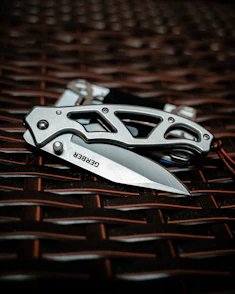 silver and black folding knife
