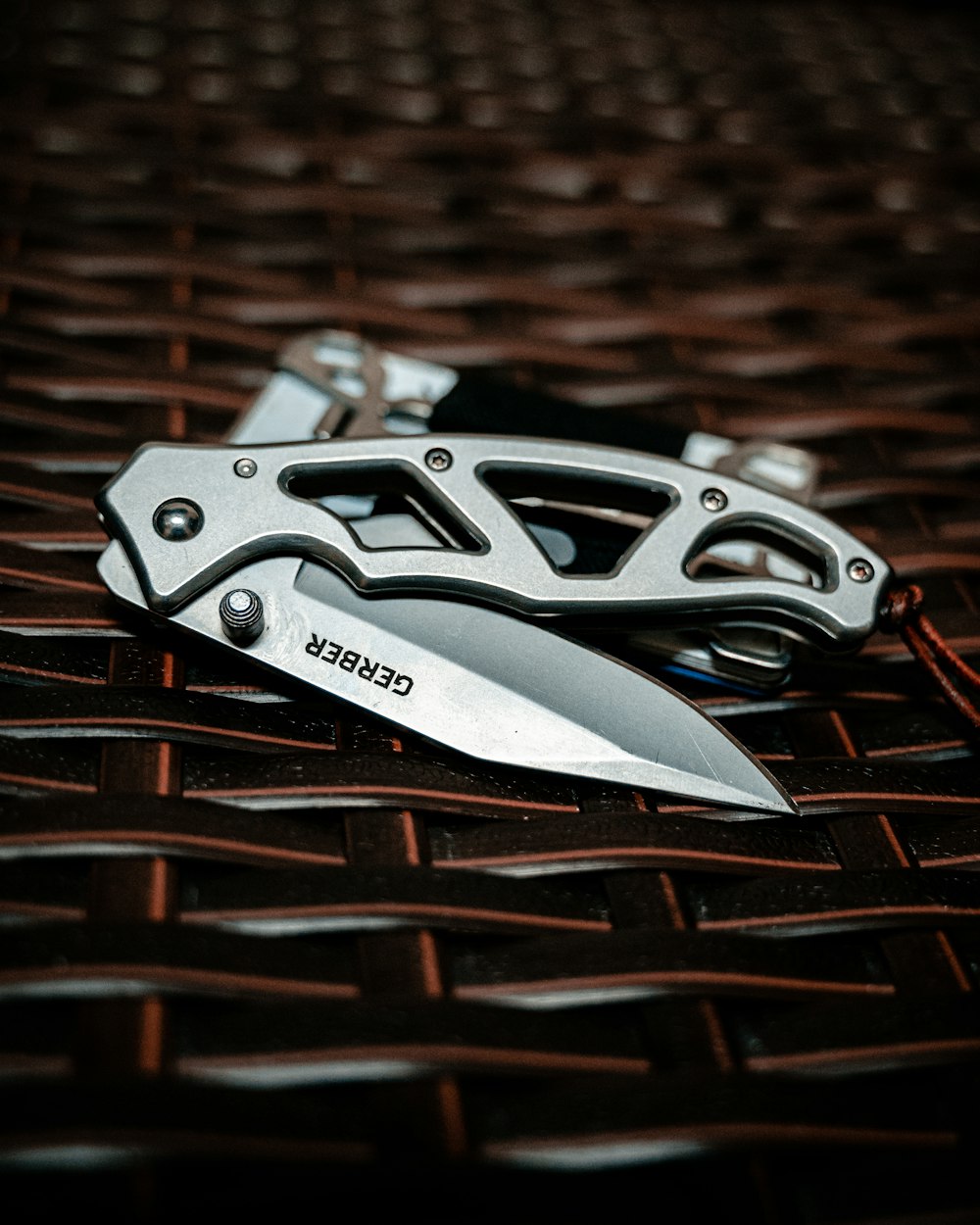 silver and black folding knife