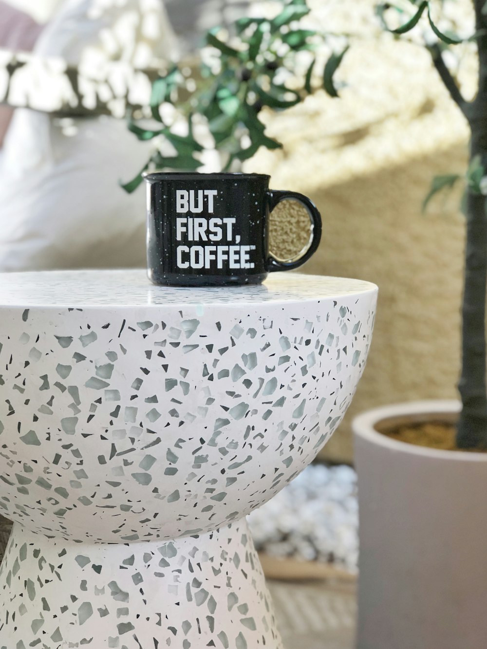 black ceramic mug on white round table