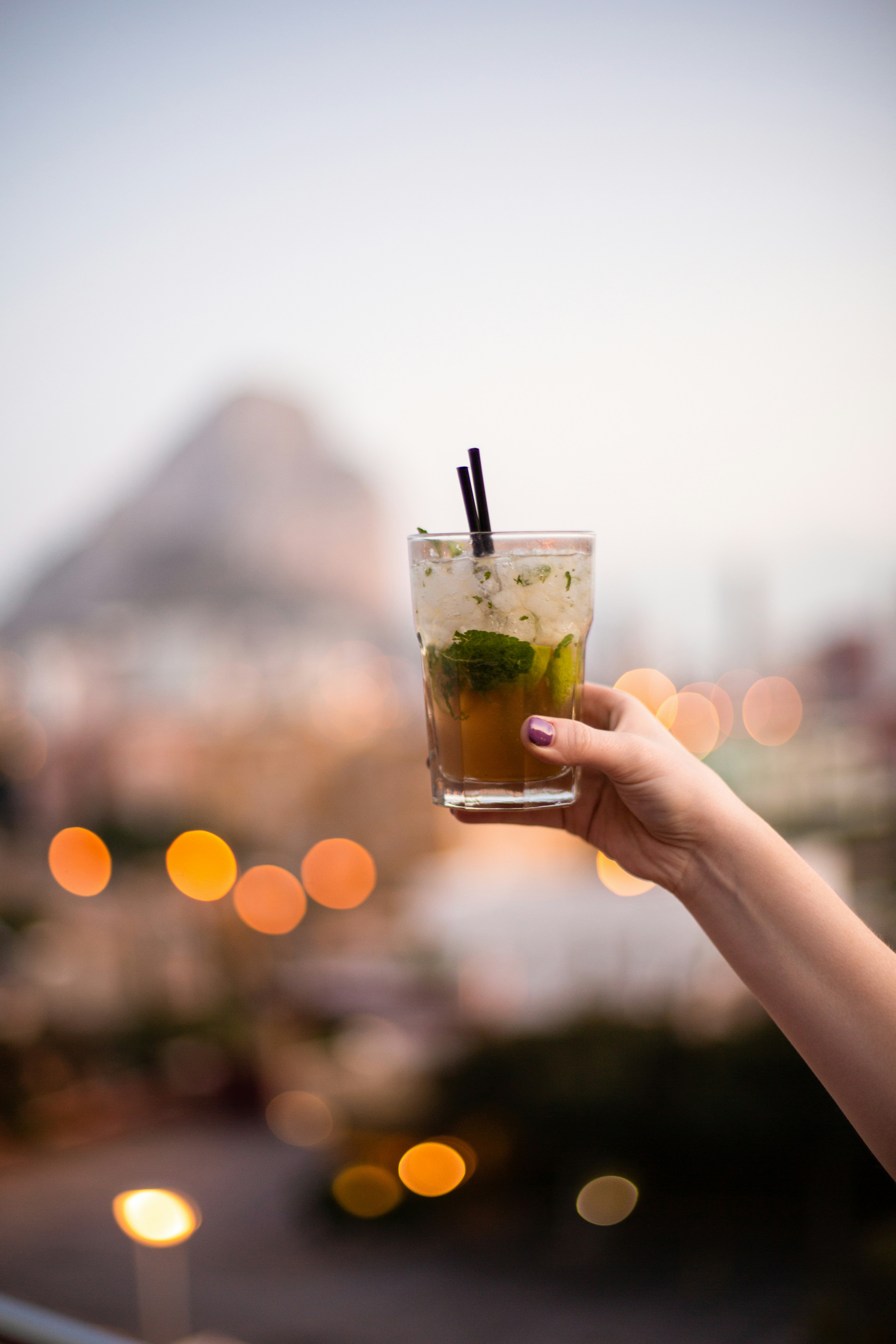 A glass of mojito with a view in the background