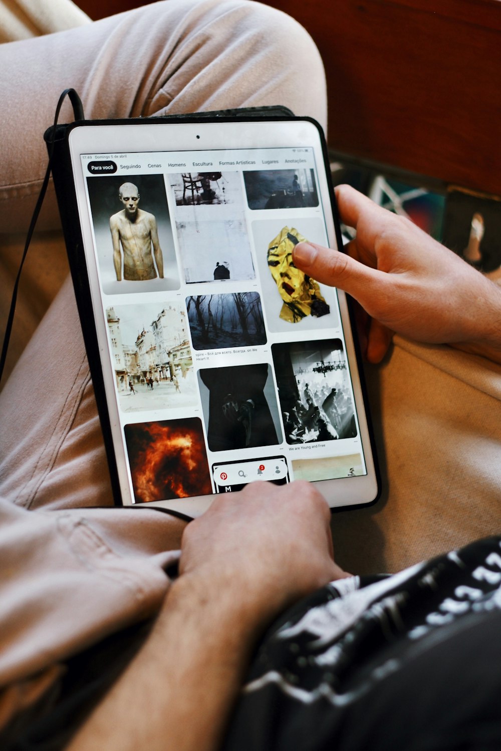 white ipad displaying man in black shirt