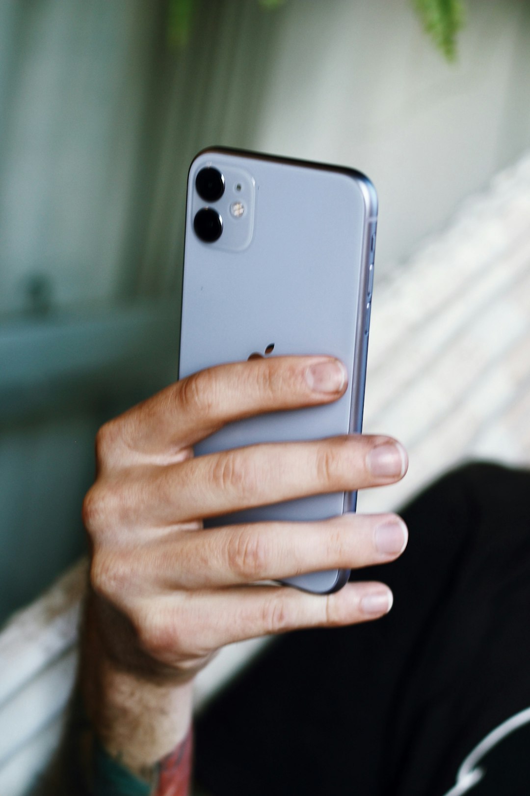 person holding silver iphone 6