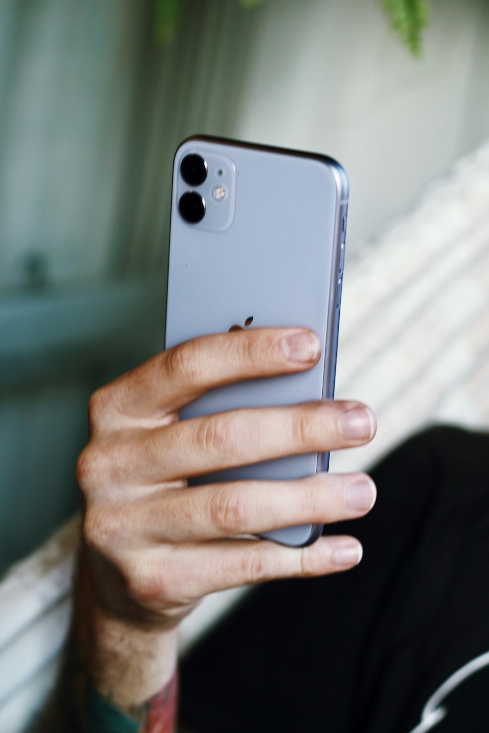 person holding silver iphone 6