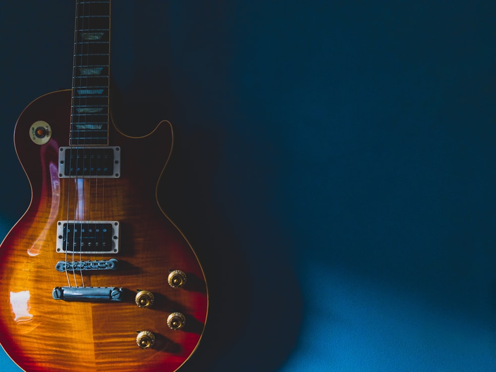 black and brown electric guitar