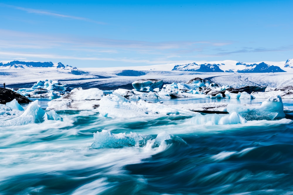 rocky shore under blue sky during daytime