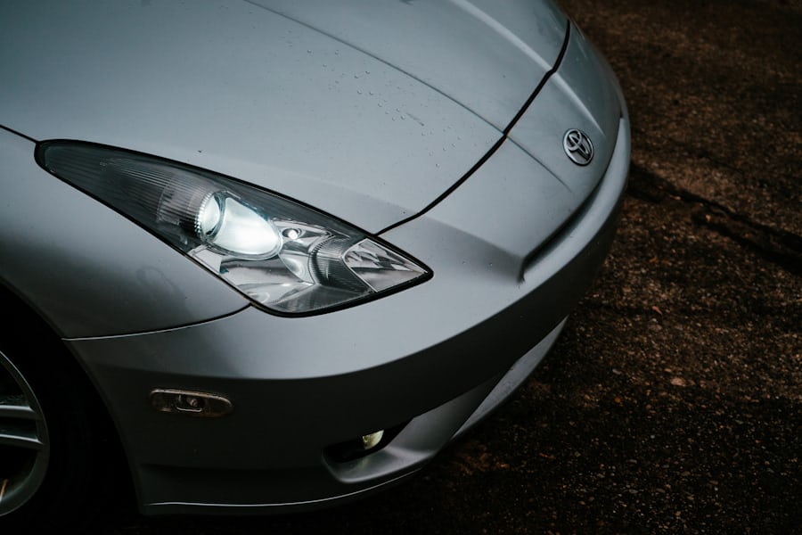 Silver car with water on hood