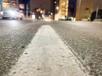 Close-up of freshly painted white road lines on an urban street in Durban.