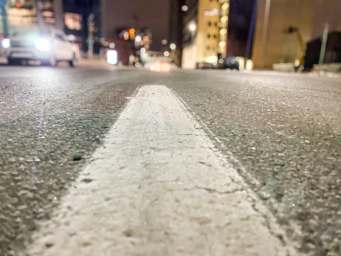 Close-up of freshly painted white road lines on an urban street in Durban.