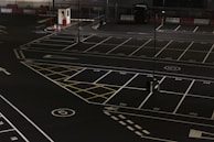 A secure parking area with 24-hour monitoring cameras visible.
