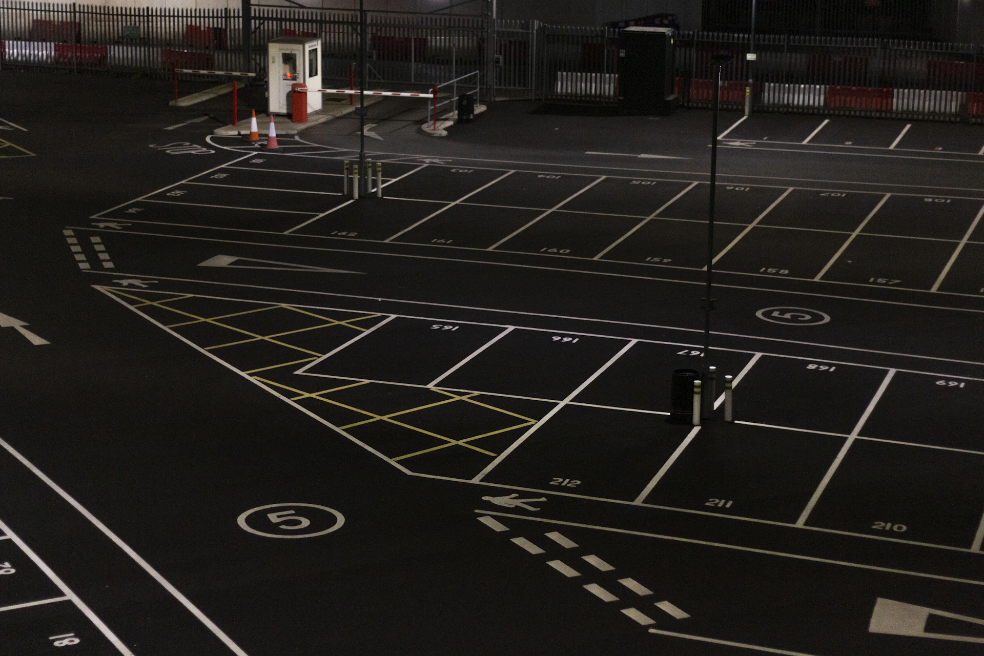 A 3D view highlighting the private gated parking area with sleek fencing and well-lit spaces.