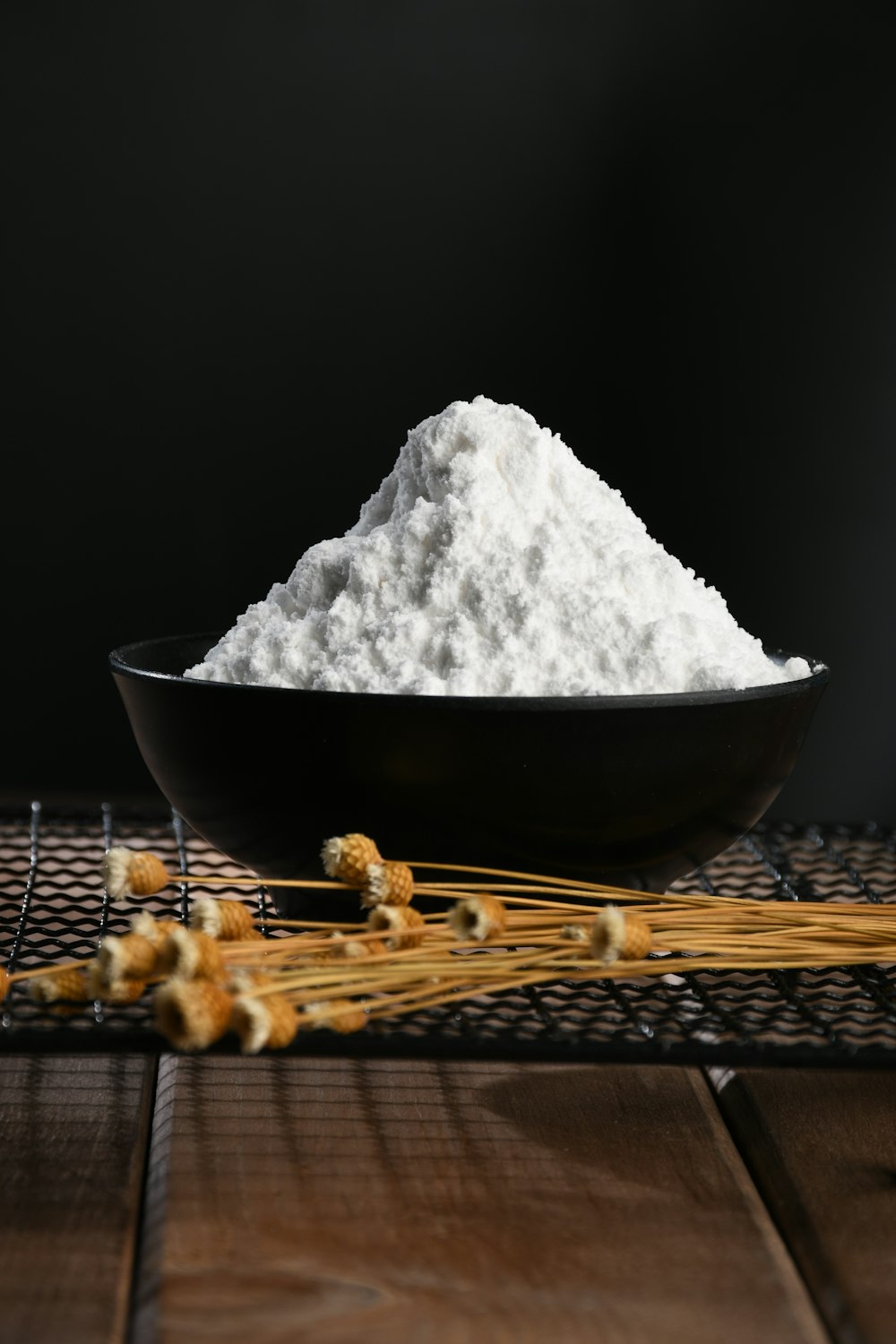 white powder on black bowl