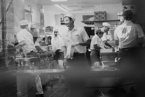 grayscale photo of man in white chef uniform