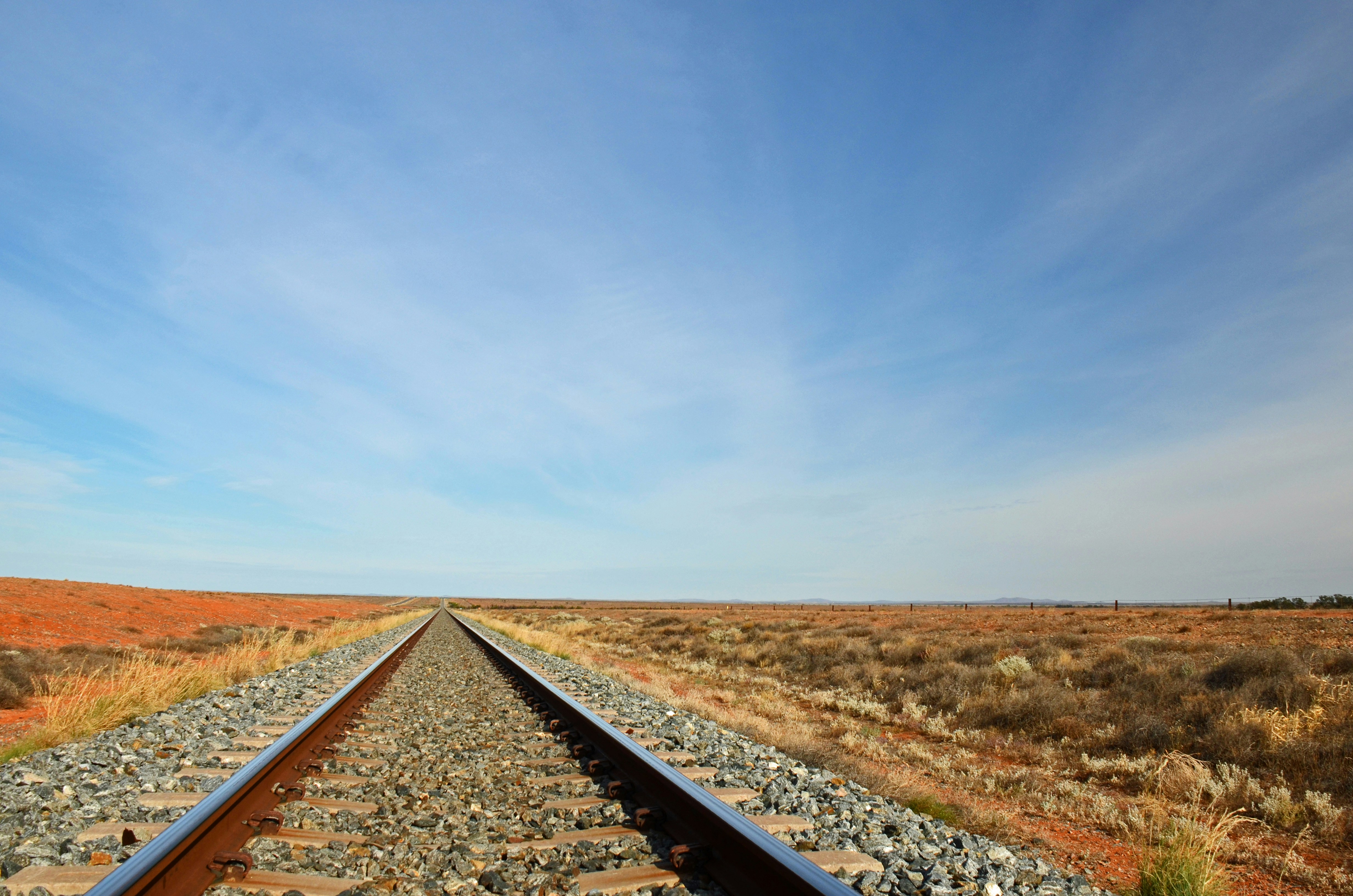 black train rail under blue sky during daytime, The Crystal Brook-Broken Hill railway line, near Mingary.