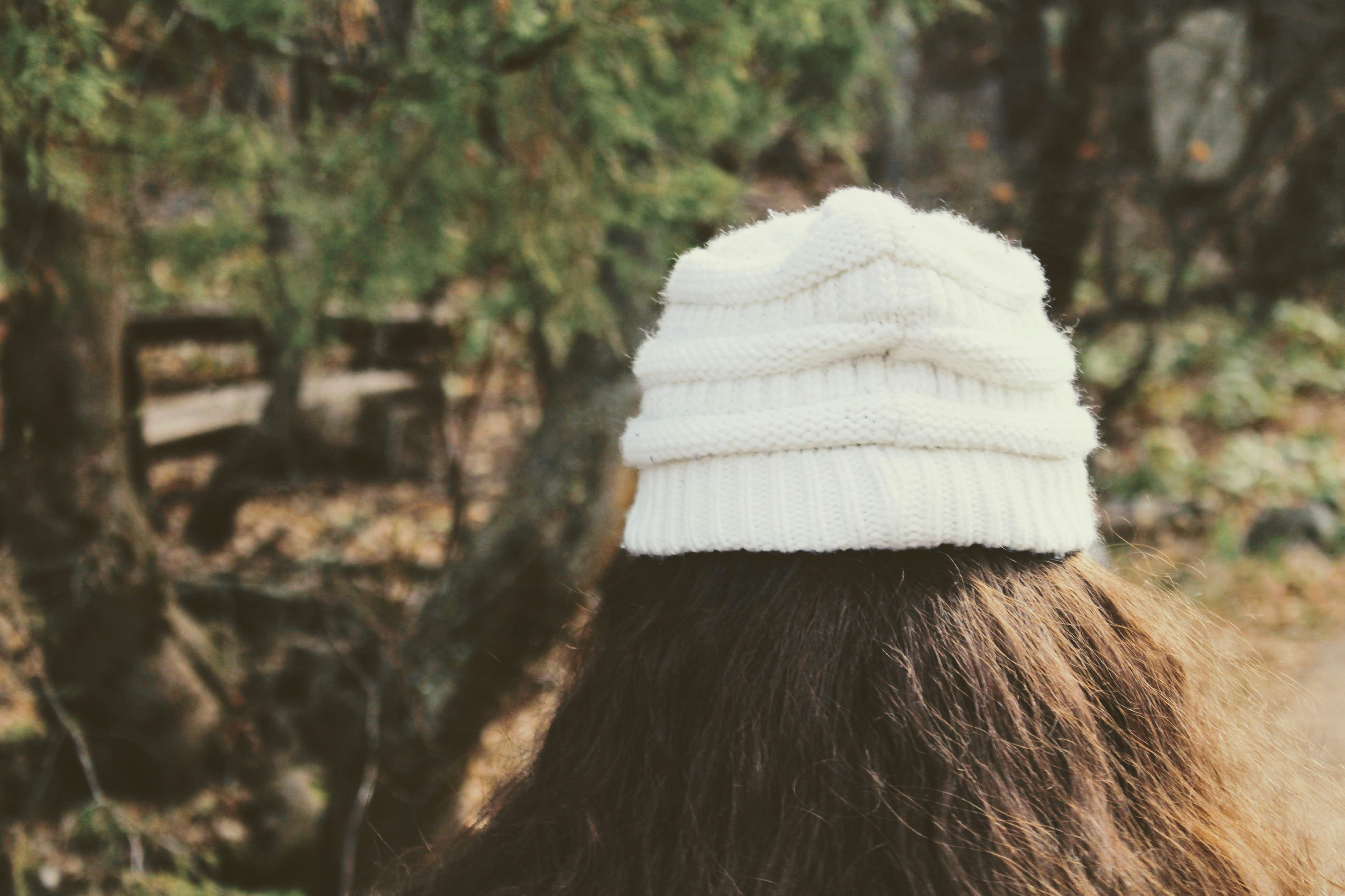 woman in white knit cap