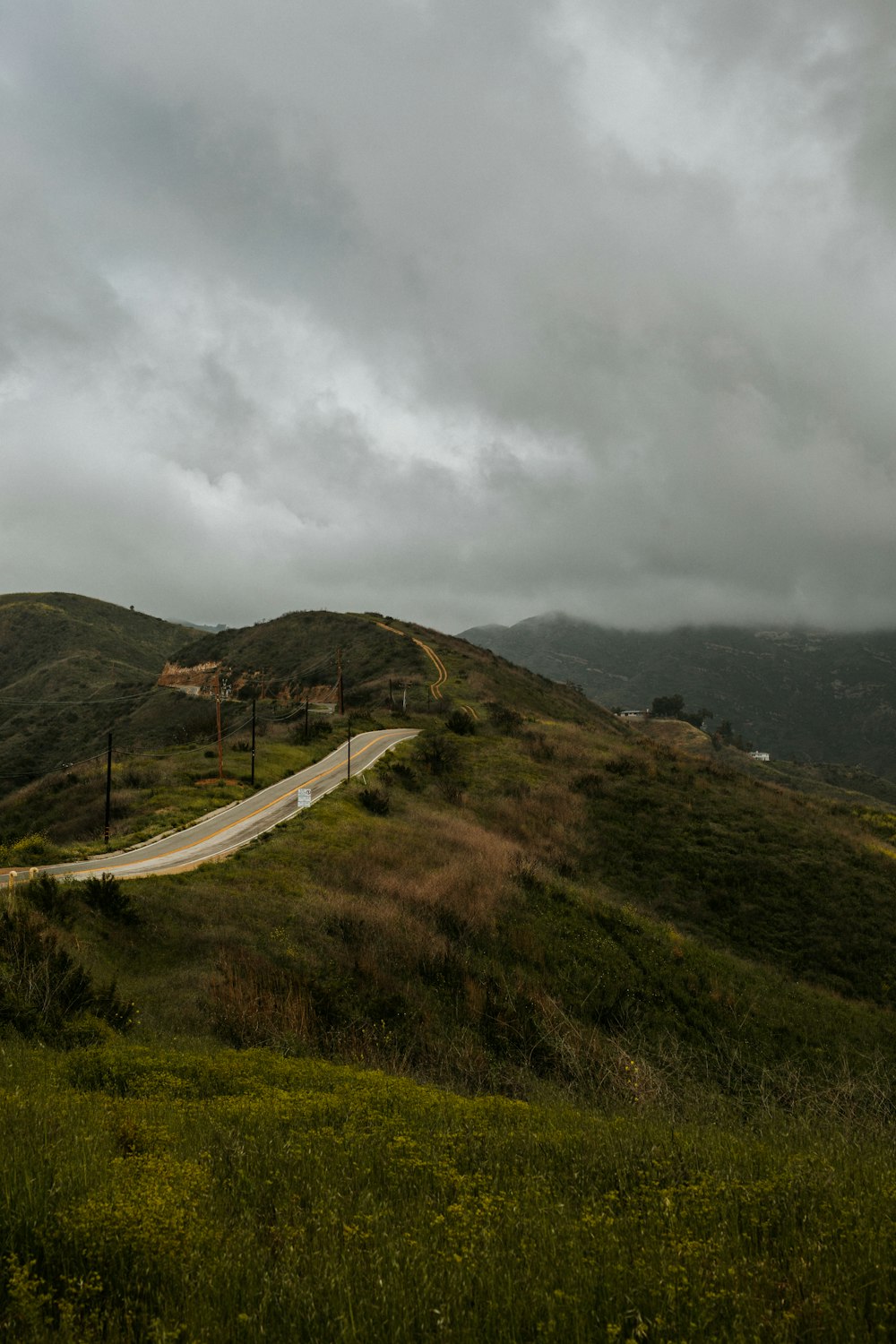 green mountain under cloudy sky during daytime