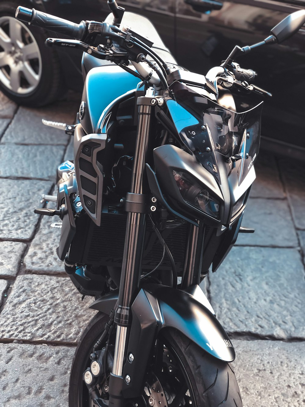 blue and black sports bike