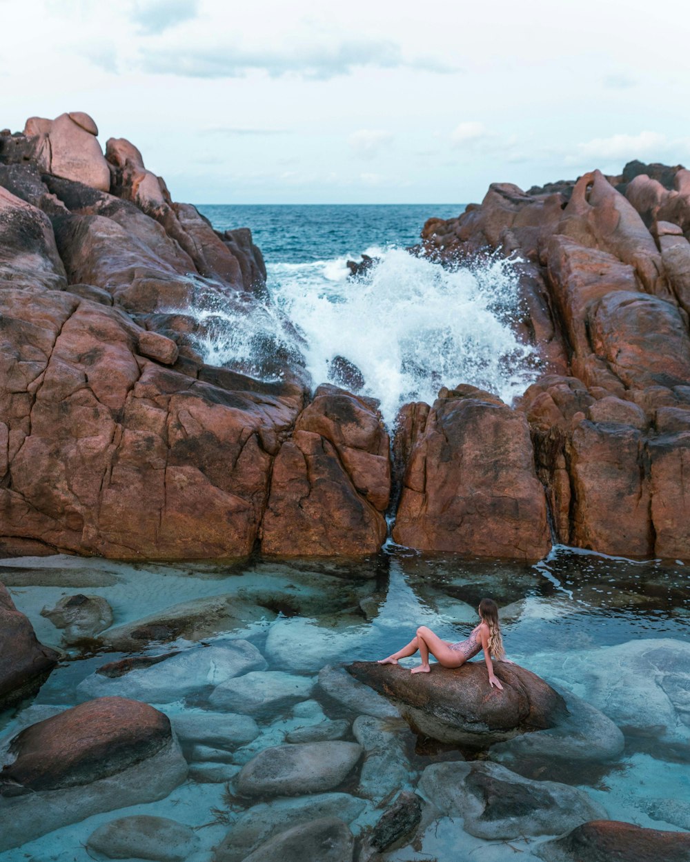 brown rock formation on sea during daytime