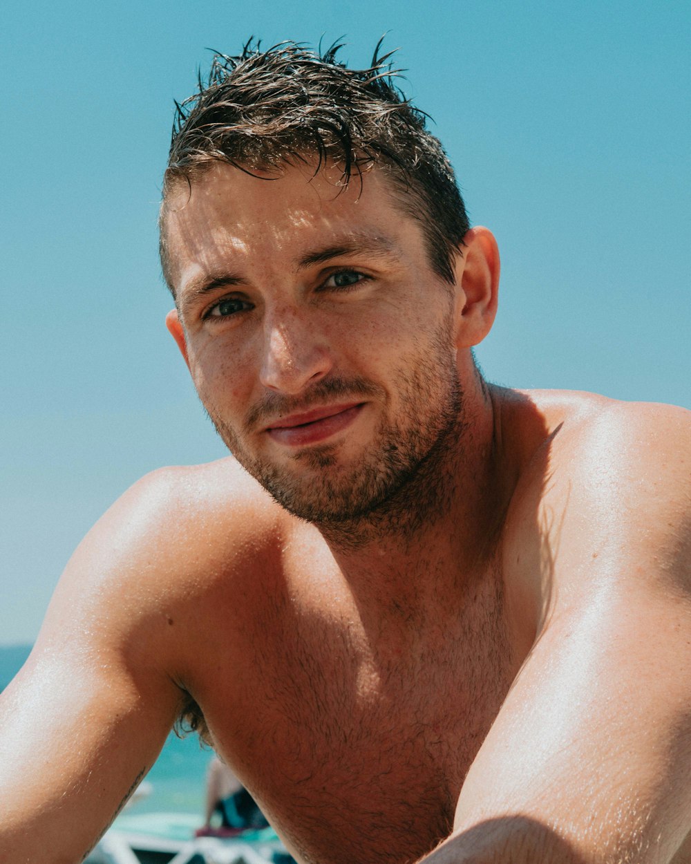 topless man under blue sky during daytime